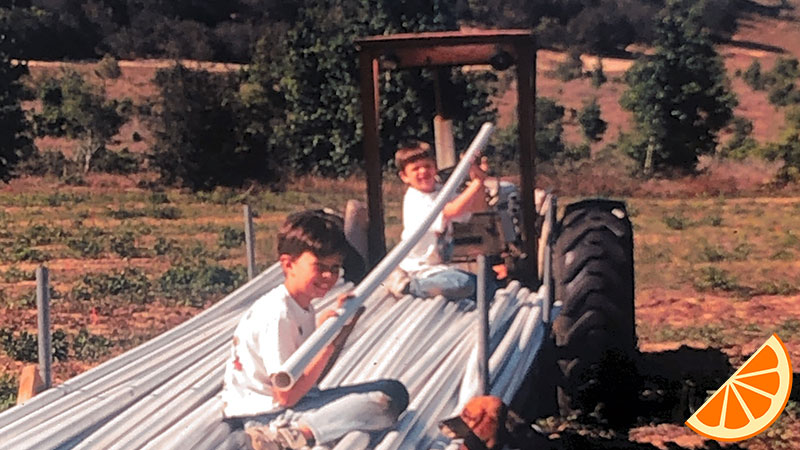 Ben & Scott "helping" lay irrigation PVC tubing.