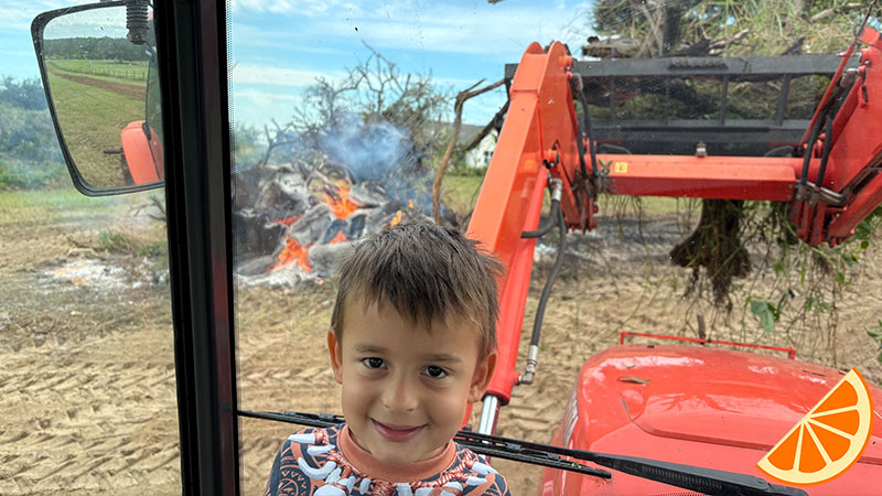 lucas-in-front-of-burn-pile